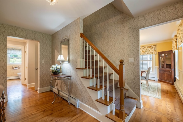 146 Old Sandown Rd, Chester, NH 03036 - staircase with hardwood / wood-style flooring, a baseboard radiator, baseboard heating, and wallpapered walls