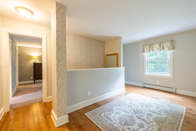 146 Old Sandown Rd, Chester, NH 03036 - unfurnished room with a baseboard radiator and wood finished floors