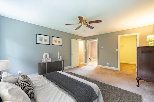 146 Old Sandown Rd, Chester, NH 03036 - bedroom with light colored carpet, a walk in closet, a ceiling fan, and ensuite bathroom
