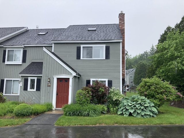 6 Monroe Dr Unit 111, Woodstock, NH 03282 - traditional home with a shingled roof and a chimney