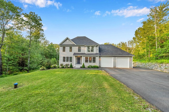 27 Westbrook Dr, New Ipswich, NH 03071 - view of front of home featuring asphalt driveway, an attached garage, a front lawn, and roof with shingles