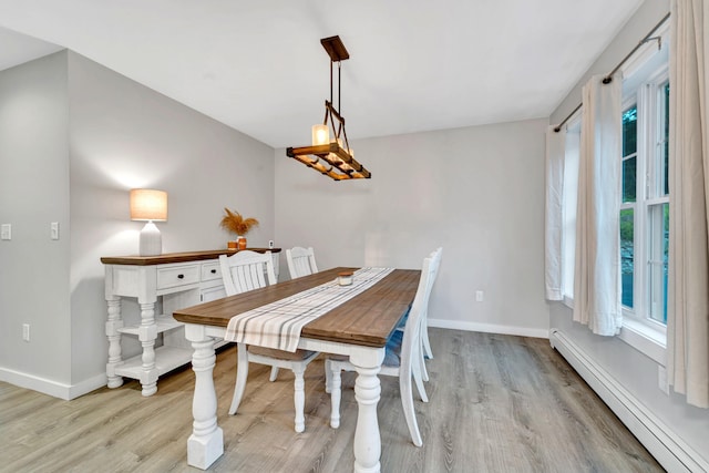 27 Westbrook Dr, New Ipswich, NH 03071 - dining space featuring a baseboard heating unit and light wood-style floors