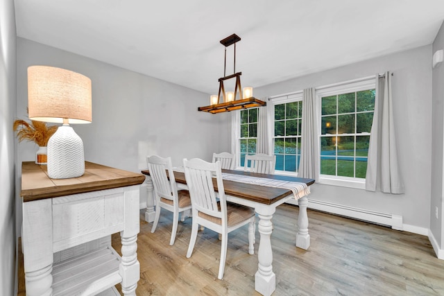 27 Westbrook Dr, New Ipswich, NH 03071 - dining room featuring baseboard heating, a chandelier, and wood finished floors