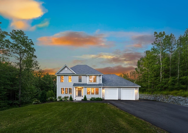 27 Westbrook Dr, New Ipswich, NH 03071 - view of front facade featuring driveway, a garage, and a lawn