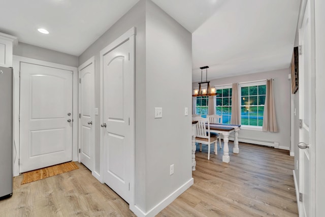27 Westbrook Dr, New Ipswich, NH 03071 - corridor with a baseboard radiator, light wood finished floors, a chandelier, and recessed lighting