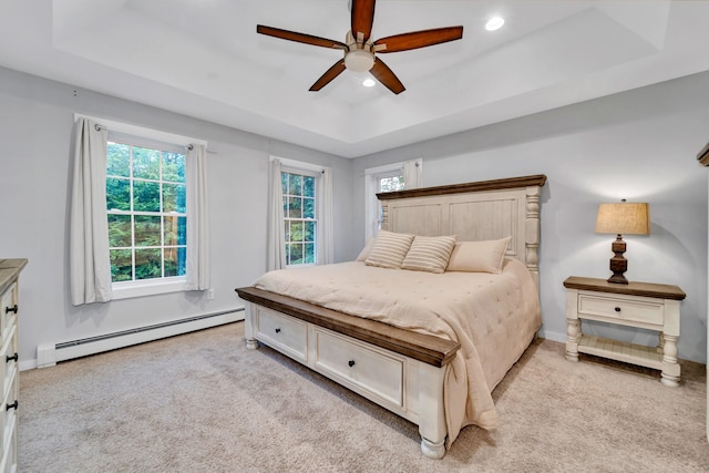 27 Westbrook Dr, New Ipswich, NH 03071 - bedroom featuring a baseboard heating unit, a tray ceiling, light colored carpet, recessed lighting, and ceiling fan