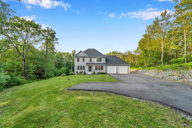 27 Westbrook Dr, New Ipswich, NH 03071 - view of front facade with asphalt driveway, a front lawn, and a garage