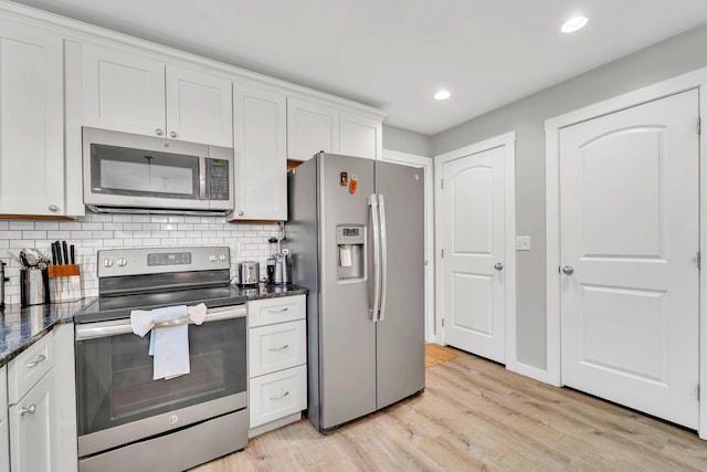 27 Westbrook Dr, New Ipswich, NH 03071 - kitchen featuring appliances with stainless steel finishes, backsplash, light wood finished floors, white cabinets, and recessed lighting