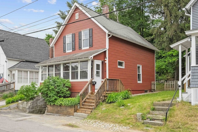 19 Highland St, Concord, NH 03301 - traditional home featuring a sunroom, a chimney, roof with shingles, stairs, and a front lawn