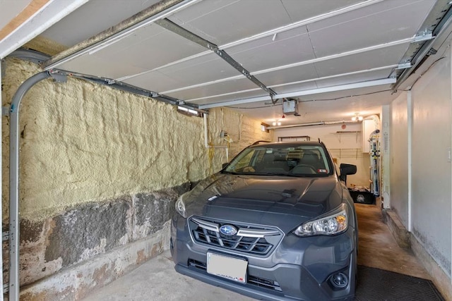 19 Highland St, Concord, NH 03301 - garage featuring a garage door opener