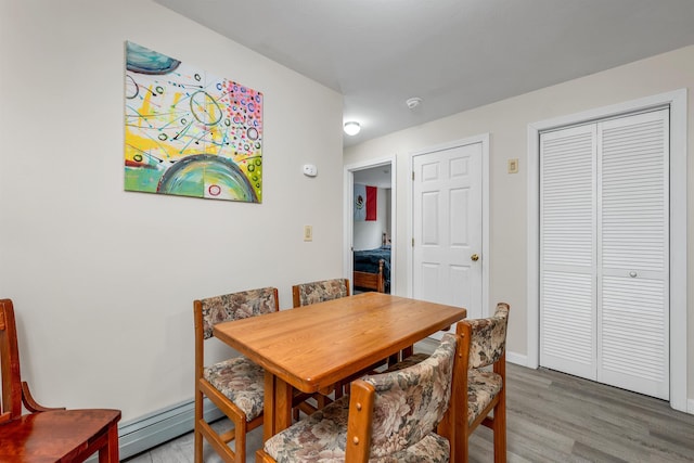 24 Meredith Center Rd, Meredith, NH 03253 - dining area with a baseboard radiator and light wood-style flooring