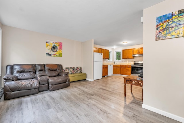 24 Meredith Center Rd, Meredith, NH 03253 - living area featuring light wood finished floors and baseboards
