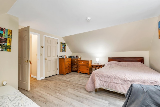 24 Meredith Center Rd, Meredith, NH 03253 - bedroom with lofted ceiling and light wood-style flooring