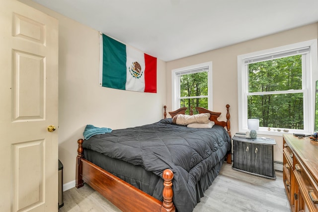 24 Meredith Center Rd, Meredith, NH 03253 - bedroom featuring light wood-type flooring and baseboard heating