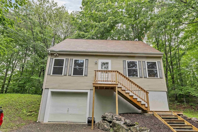 24 Meredith Center Rd, Meredith, NH 03253 - view of front of home with stairway and an attached garage