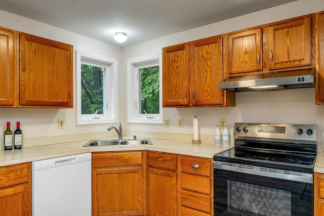 24 Meredith Center Rd, Meredith, NH 03253 - kitchen with stainless steel range with electric stovetop, dishwasher, under cabinet range hood, light countertops, and brown cabinetry