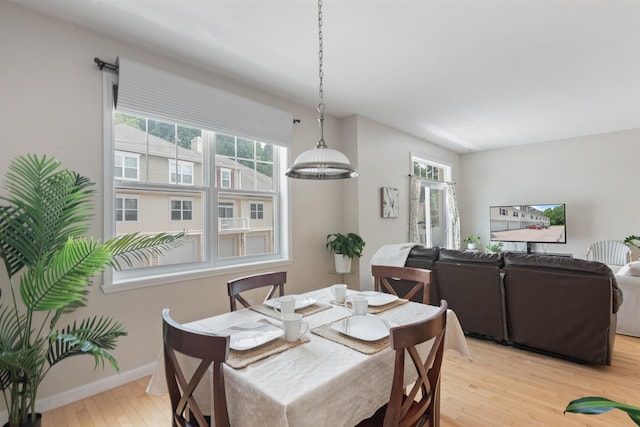 67 Pearl St Unit 8, Essex Junction, VT 05452 - dining space with light wood-type flooring and baseboards