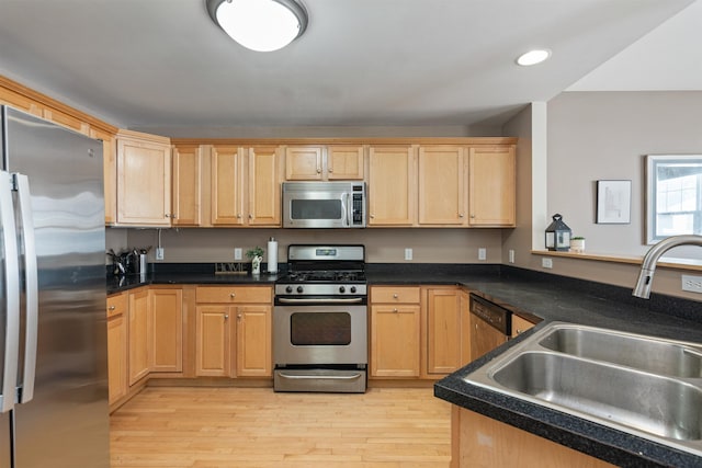 67 Pearl St Unit 8, Essex Junction, VT 05452 - kitchen featuring stainless steel appliances, light wood-type flooring, recessed lighting, light brown cabinets, and dark countertops