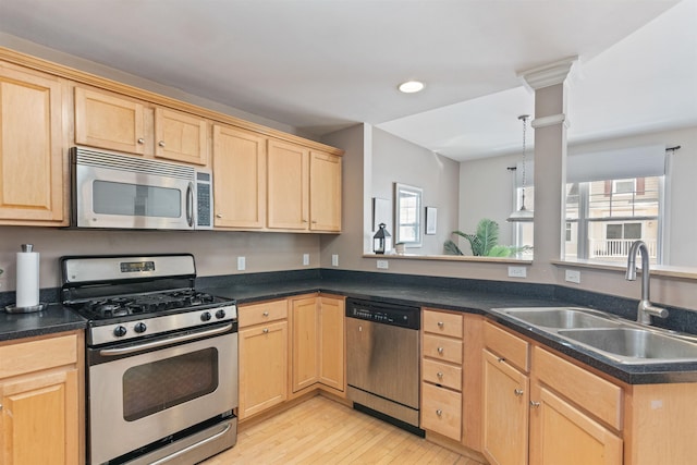 67 Pearl St Unit 8, Essex Junction, VT 05452 - kitchen with stainless steel appliances, light brown cabinets, plenty of natural light, light wood-style flooring, and recessed lighting