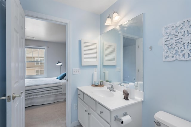 67 Pearl St Unit 8, Essex Junction, VT 05452 - ensuite bathroom with vanity and toilet
