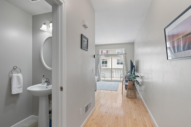 67 Pearl St Unit 8, Essex Junction, VT 05452 - corridor with wood-type flooring and baseboards