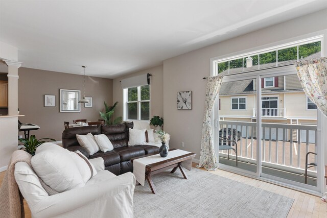 67 Pearl St Unit 8, Essex Junction, VT 05452 - living area featuring plenty of natural light and wood finished floors