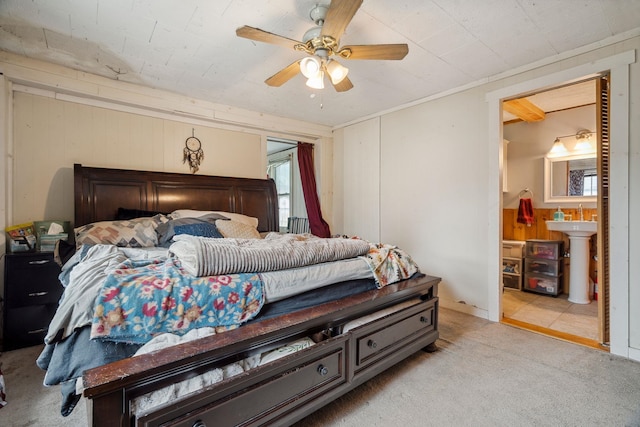 11 Providence Ave, Claremont, NH 03743 - carpeted bedroom with ceiling fan, wood walls, and ensuite bathroom