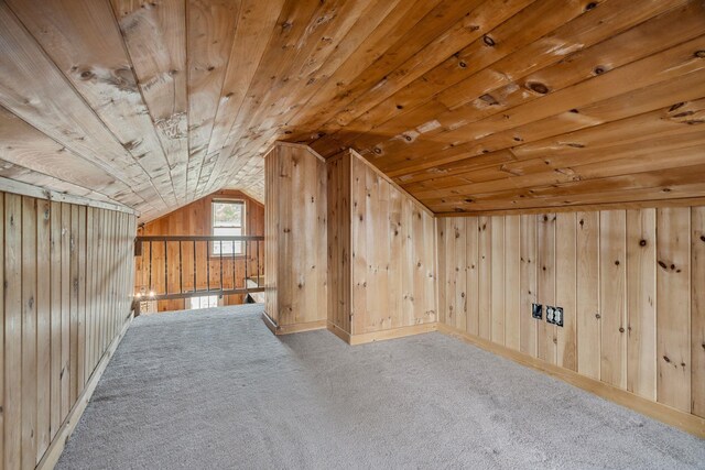 11 Providence Ave, Claremont, NH 03743 - additional living space with lofted ceiling, carpet flooring, wood walls, and wooden ceiling