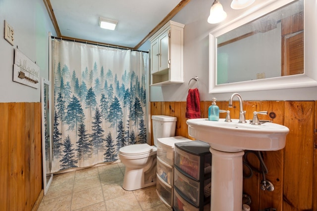 11 Providence Ave, Claremont, NH 03743 - bathroom featuring wooden walls, curtained shower, and a wainscoted wall
