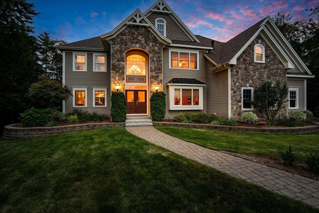 74 Settlers Ct, Bedford, NH 03110 - view of front facade with stone siding and a lawn