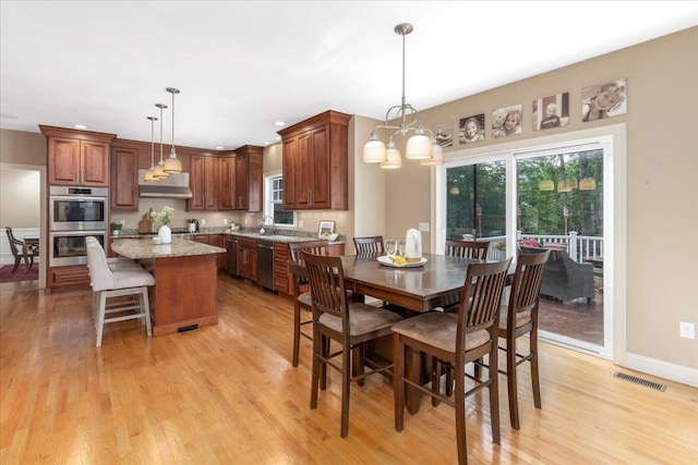 74 Settlers Ct, Bedford, NH 03110 - dining space with light wood-type flooring and recessed lighting