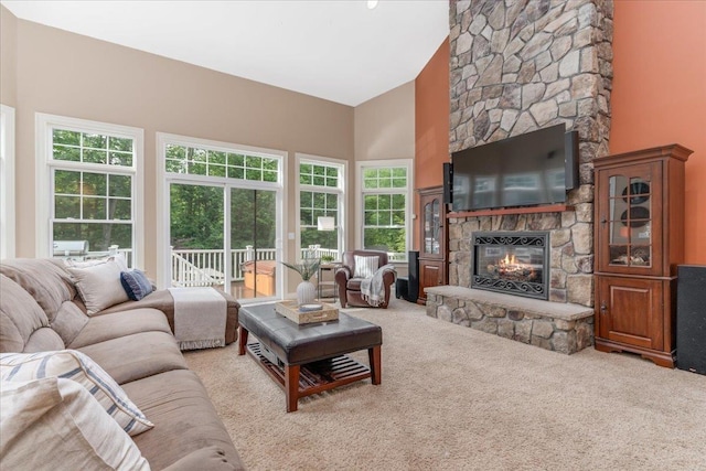 74 Settlers Ct, Bedford, NH 03110 - living room with a fireplace, carpet flooring, and high vaulted ceiling