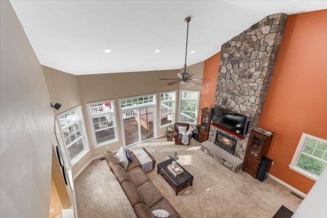 74 Settlers Ct, Bedford, NH 03110 - living area with high vaulted ceiling, a ceiling fan, a fireplace, and carpet flooring
