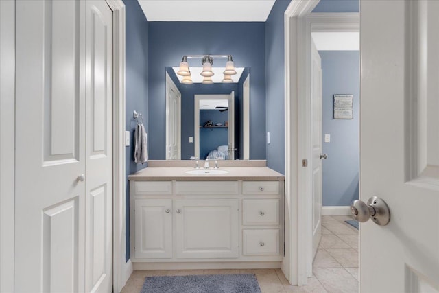 74 Settlers Ct, Bedford, NH 03110 - bathroom featuring vanity, a chandelier, tile patterned floors, and a closet