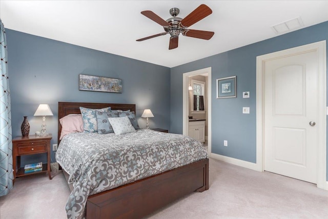 74 Settlers Ct, Bedford, NH 03110 - bedroom with light colored carpet, ensuite bathroom, and ceiling fan