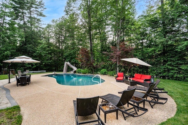 74 Settlers Ct, Bedford, NH 03110 - swimming pool with a water slide, a patio, and outdoor dining space