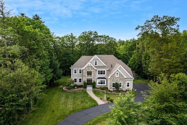 74 Settlers Ct, Bedford, NH 03110 - view of subject property with a heavily wooded area