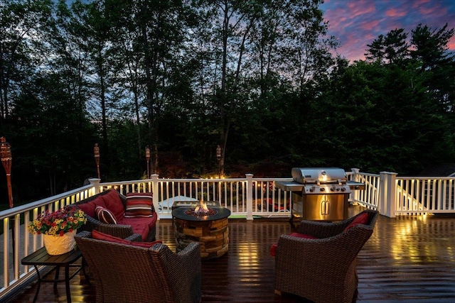 74 Settlers Ct, Bedford, NH 03110 - deck at dusk featuring a fire pit and grilling area