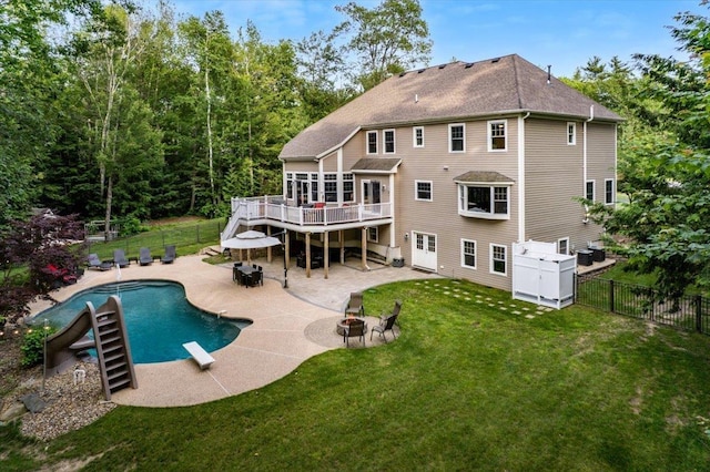 74 Settlers Ct, Bedford, NH 03110 - rear view of property featuring an outdoor fire pit, a deck, a fenced backyard, and a patio area