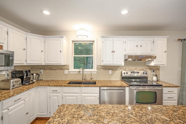 26 Harvard Ln, Bedford, NH 03110 - kitchen featuring stainless steel appliances, under cabinet range hood, white cabinetry, and recessed lighting