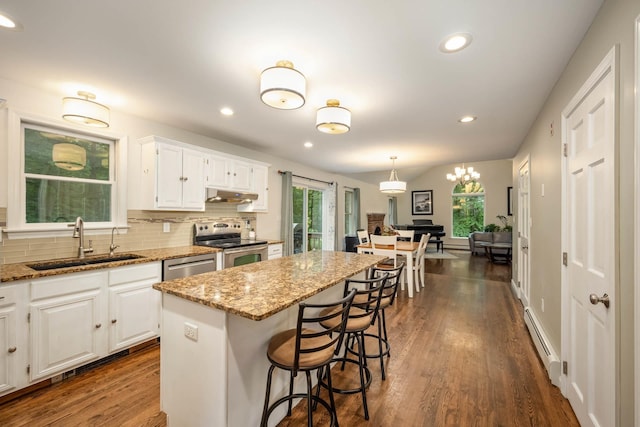 26 Harvard Ln, Bedford, NH 03110 - kitchen featuring stainless steel appliances, under cabinet range hood, a baseboard heating unit, plenty of natural light, and recessed lighting