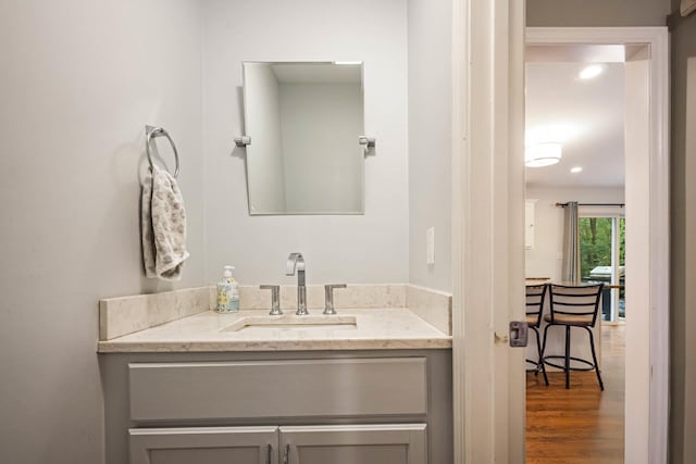 26 Harvard Ln, Bedford, NH 03110 - bathroom featuring vanity, wood finished floors, and recessed lighting