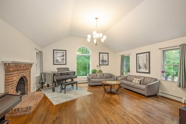 26 Harvard Ln, Bedford, NH 03110 - living room with a baseboard heating unit, wood finished floors, vaulted ceiling, plenty of natural light, and a fireplace