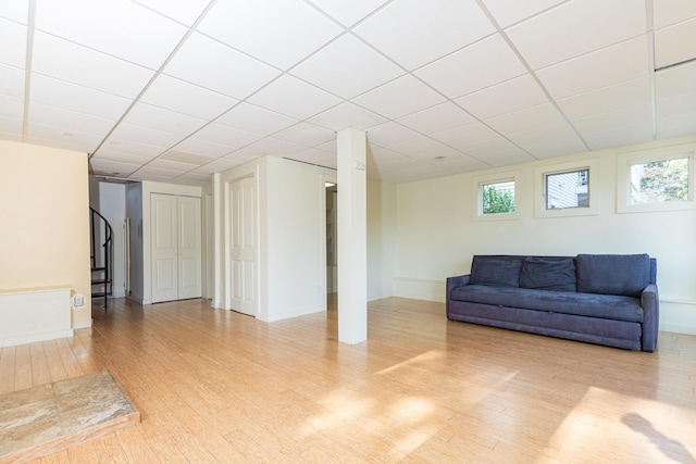 11 Bridge St, Kittery, ME 03904 - living room featuring wood finished floors, a drop ceiling, and stairs