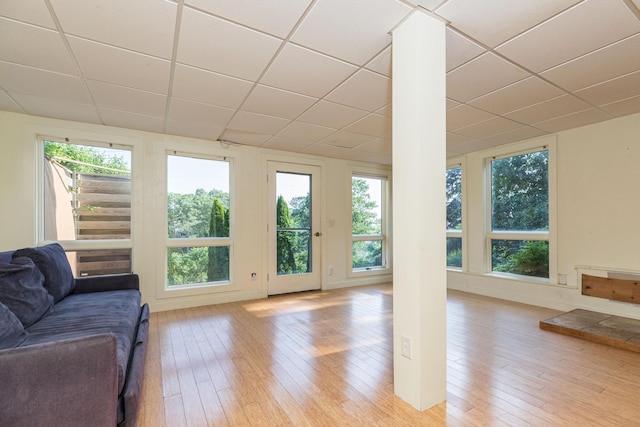 11 Bridge St, Kittery, ME 03904 - living area with a paneled ceiling, light wood-style floors, and ornate columns