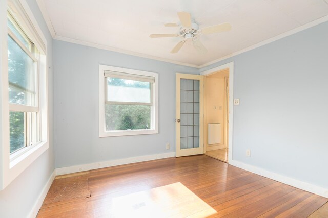 11 Bridge St, Kittery, ME 03904 - unfurnished room with ornamental molding, healthy amount of natural light, wood finished floors, and ceiling fan