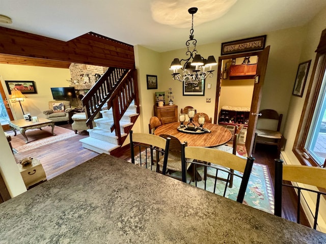 851 German Flats Rd, Fayston, VT 05673 - dining space with a chandelier, stairway, and wood finished floors