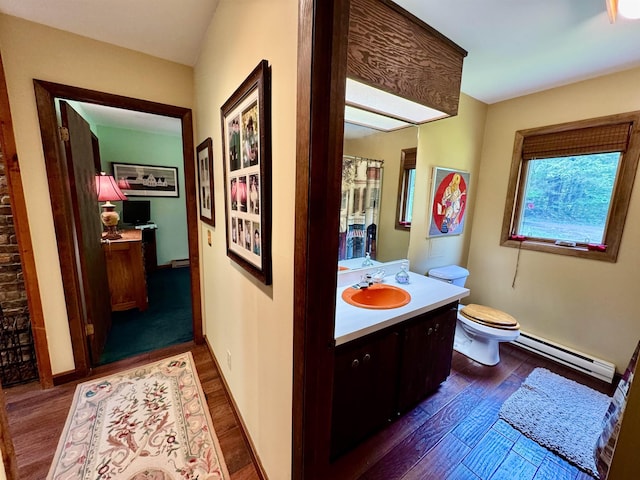 851 German Flats Rd, Fayston, VT 05673 - bathroom featuring baseboard heating, wood finished floors, and vanity