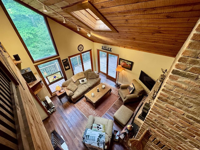 851 German Flats Rd, Fayston, VT 05673 - living room with a skylight, wood ceiling, lofted ceiling, track lighting, and hardwood / wood-style flooring