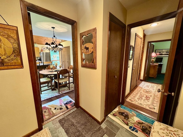 851 German Flats Rd, Fayston, VT 05673 - corridor with a chandelier and baseboards